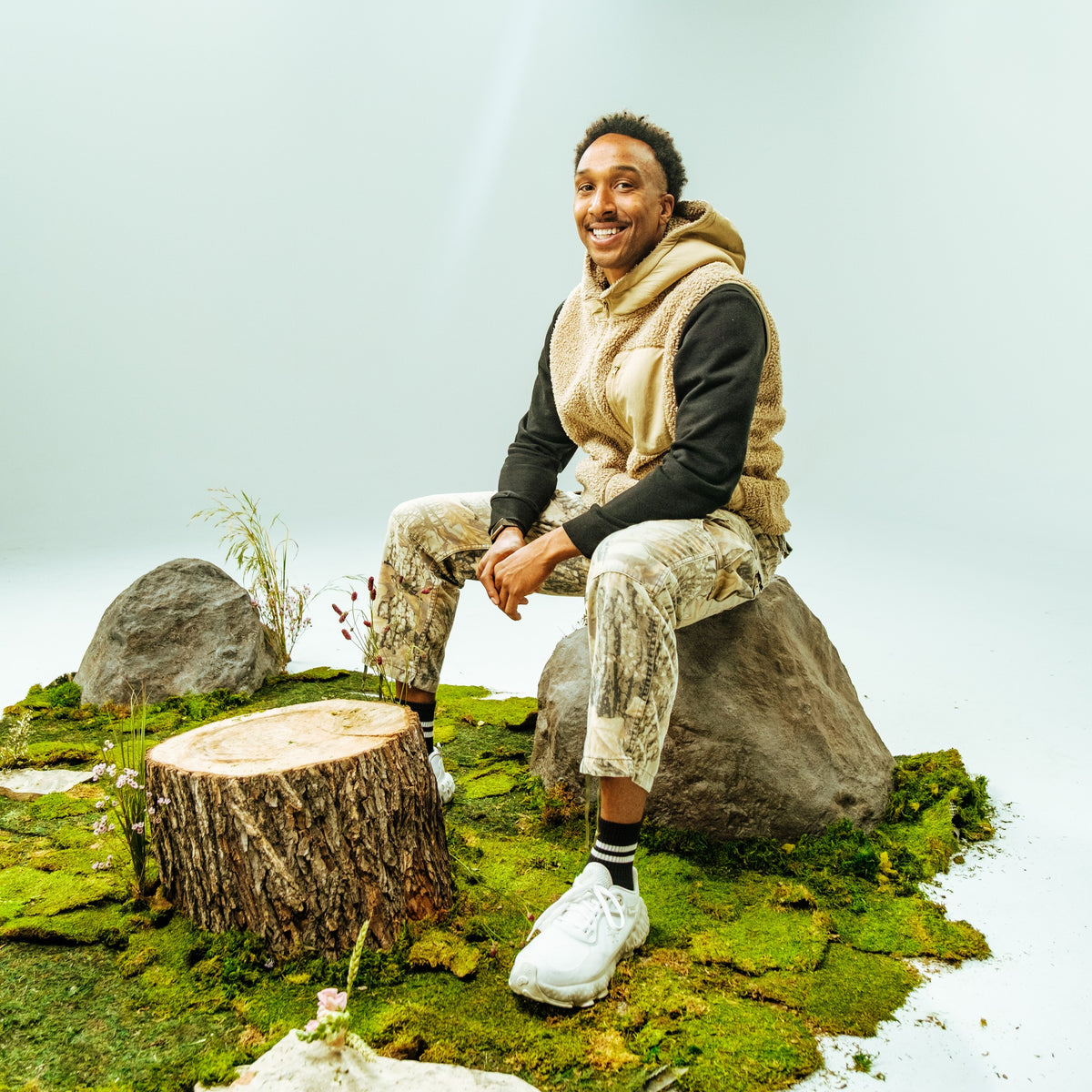 Lawrence Whitaker III, co-founder and CEO of Vybrance Labs, seated on the Vybrance studio nature set